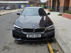 Silver BMW parked on a road in a London